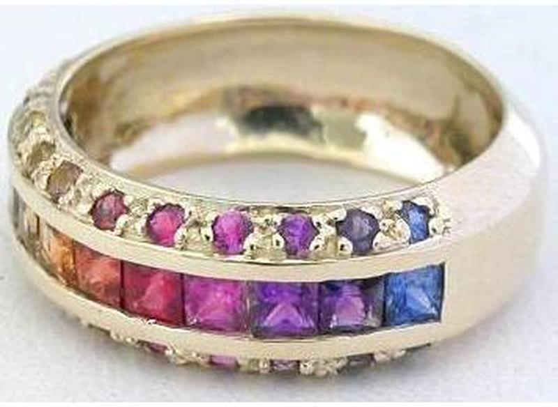 Vibrant Rainbow Sapphires Channel and Prong Set in an Anniversary Style Ring in 14k yellow gold
