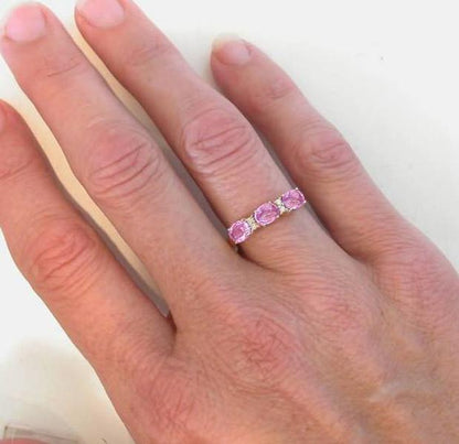 Anniversary Ring with Three East West Set Oval Pink Sapphires with Diamond Accents in 14k yellow gold