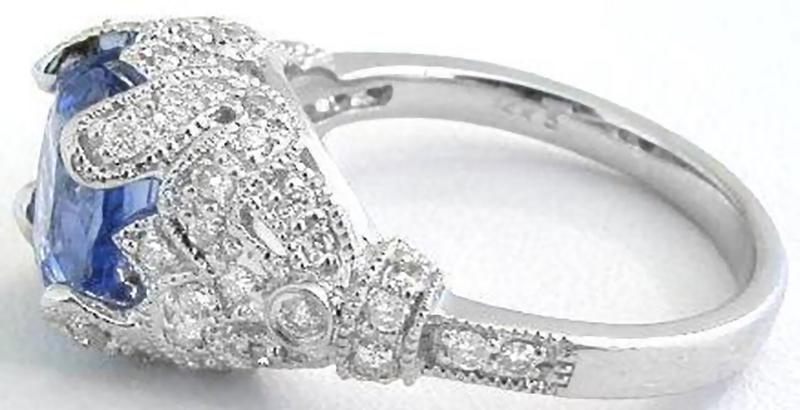 Real Platinum Natural Oval Blue Sapphire Ring in a antique style mounting with real diamonds