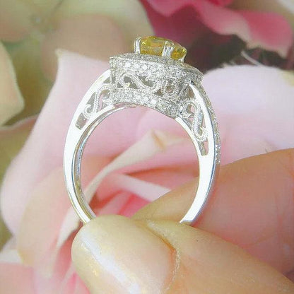 Radiant Emerald Cut Natural Yellow Sapphire Ring with a Double Diamond Halo in 14k white gold