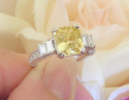 One of a kind Unheated Natural Yellow Sapphire Ring featuring double baguette diamonds and round diamonds in vintage design