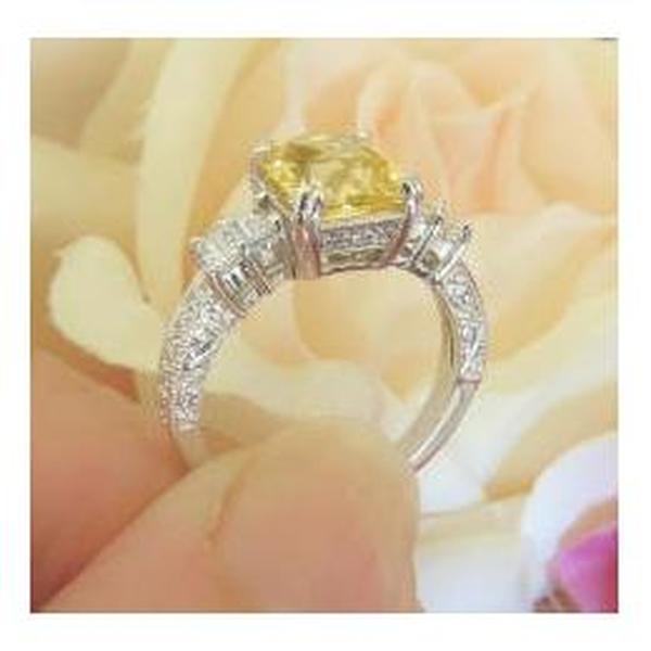 Side View of Natural Radiant Cut Untreated Yellow Sapphire Ring showing Engraved Detail