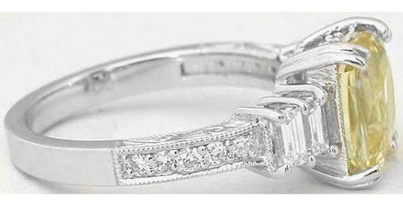 Natural Radiant Cut Unheated Yellow Sapphire Ring with Baguette Diamonds in 18k white gold for sale