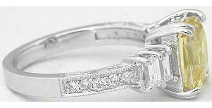 Natural Radiant Cut Unheated Yellow Sapphire Ring with Baguette Diamonds in 18k white gold for sale