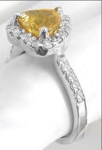 Side View of Heart Cut 7mm Orange Yellow Sapphire with Diamond Halo Design Setting in 18k white gold