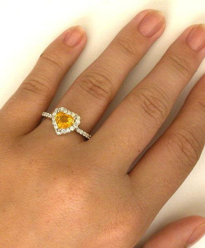 One of a Kind Heart Shape Natural Unheated Yellow-Orange Sapphire Engagement Ring in 18k on the finger