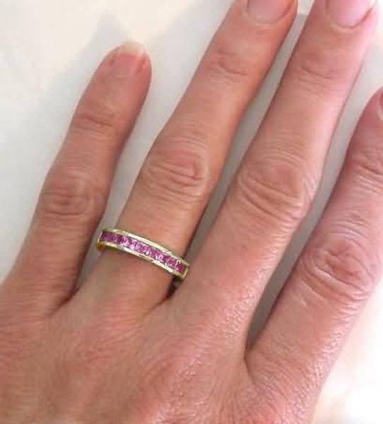 Pink Sapphire Weddding Bands with Princess Cut Pink Sapphires in a Channel Setting in 14k yellow gold
