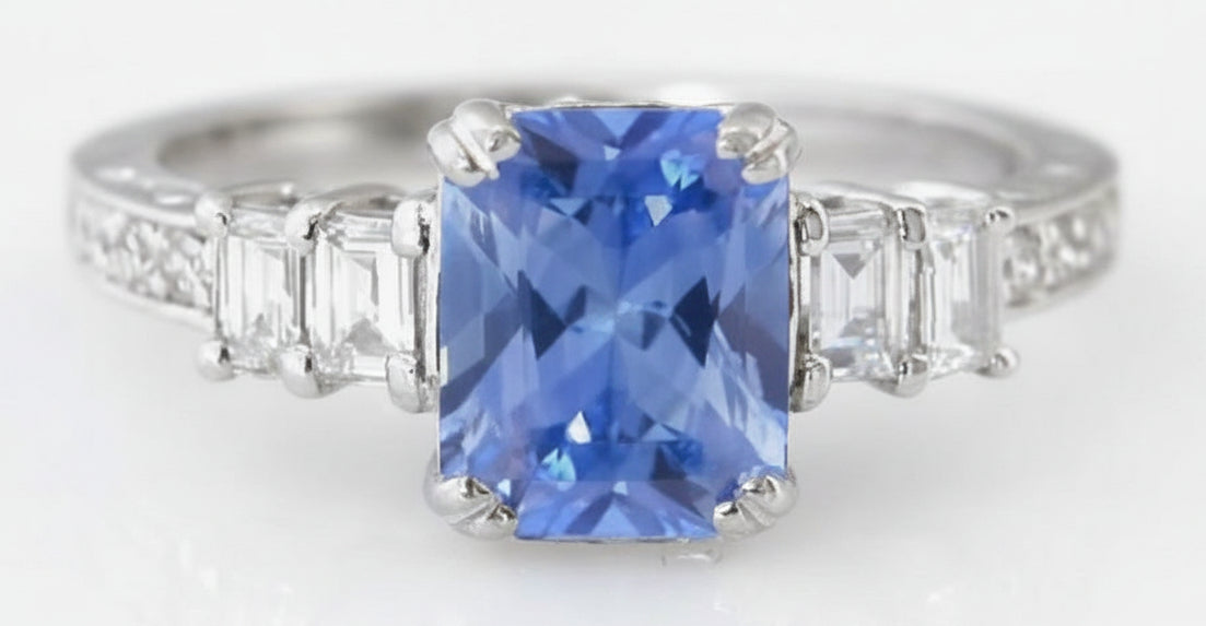 Sapphire Engagement Ring with Natural Ceylon Blue Sapphire in a Radiant Cut Paired with Fine Baguette Diamonds in 18k white gold