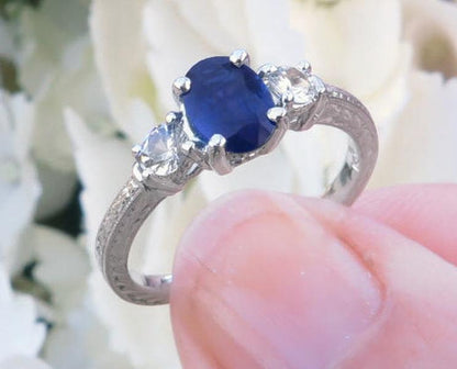 Natural Oval Blue Sapphire and Round White Sapphire Engagement Ring in 14k white gold for sale
