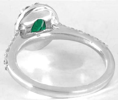 Natural Colombian Emerald Ring with Brilliant Diamond Halo Setting and Diamonds Accenting the band in 14k white gold