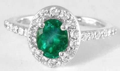 Natural Colombian Emerald Ring with Brilliant Diamond Halo Setting and Diamonds Accenting the band in 14k white gold