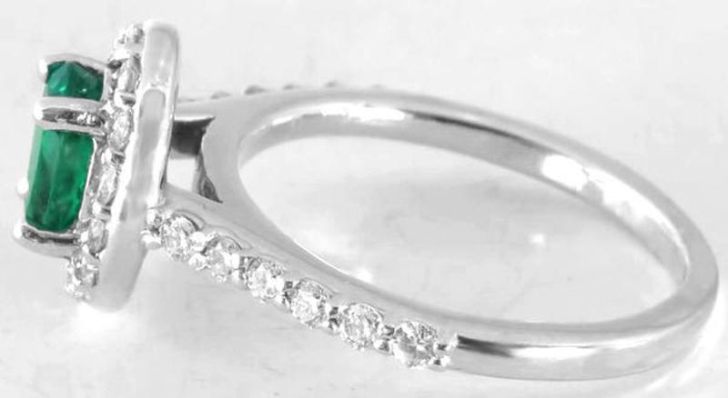 Side View of Diamond Halo Engagement Ring Featuring 7x5mm Oval Colombian Emerald in 14k white gold
