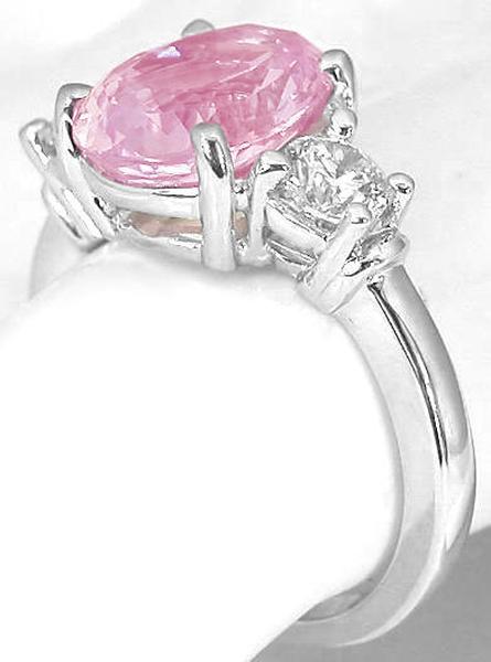 Natural Oval Cut Pink Sapphire and Round Cut Diamond Three Stone Engagement Ring in 14k white gold for sale