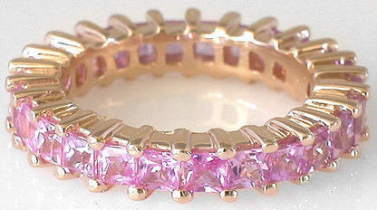 Princess cut natural pink sapphire eternity ring in gold