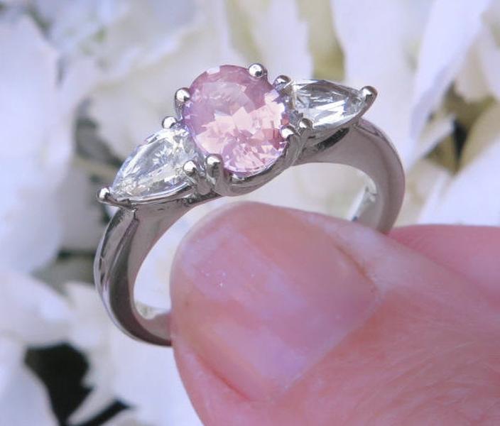 Oval Real Light Pink Sapphire Three Stone Ring with Natural White Sapphire side gemstones in solid 14k white gold