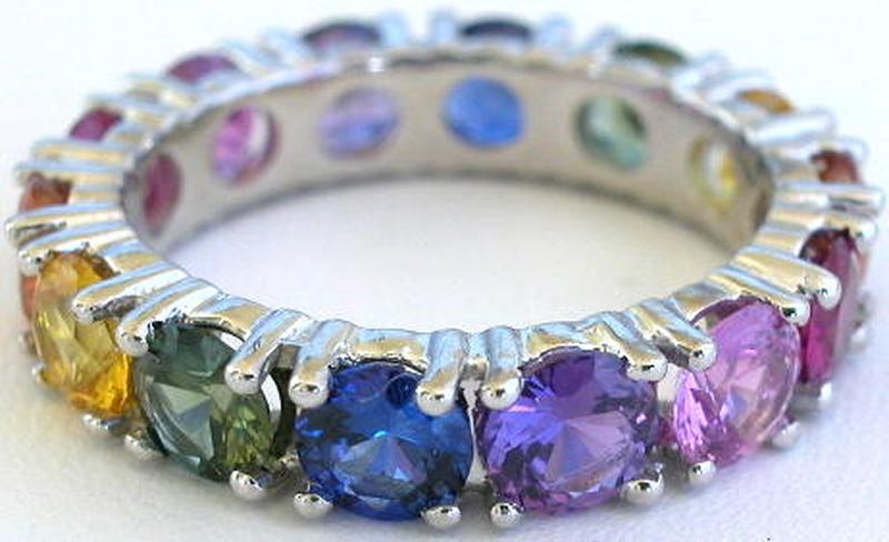 Round cut natural rainbow sapphire eternity ring in gold