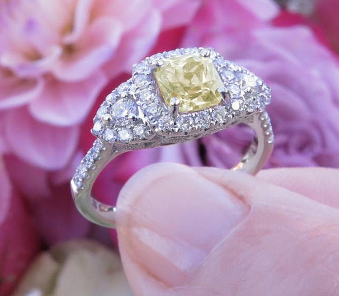 Natural Radiant Yellow Sapphire Three Stone Engagement Ring with a Real Diamond Halo in 18k white gold for sale