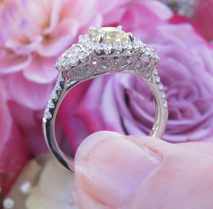 Natural Radiant Yellow Sapphire Three Stone Statement Ring with a Real Diamond Halo in 18k white gold for sale