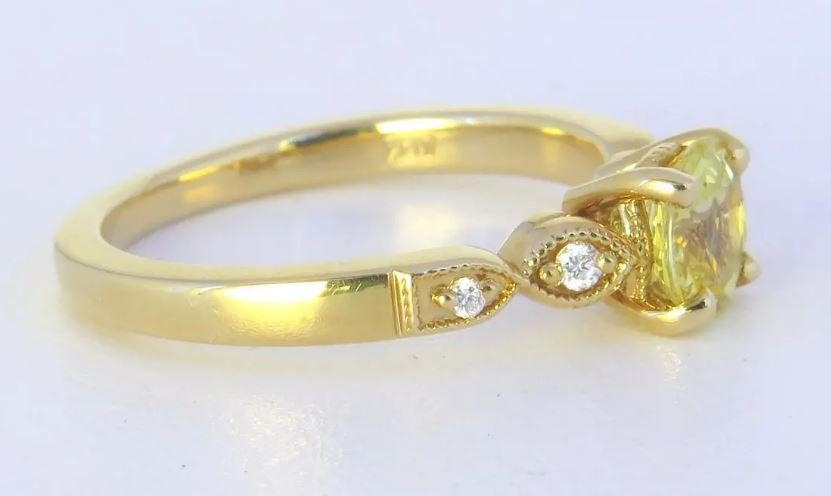 Round yellow sapphire engagement ring with marquise diamond accents