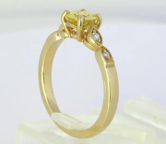 Vintage-inspired yellow sapphire and diamond ring with milgrain detail