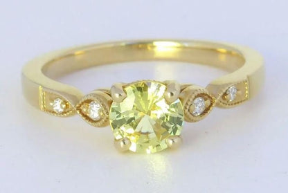 Natural yellow sapphire and diamond ring in 14k yellow gold