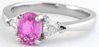 Natural Oval Pink Sapphire and Trillion Diamond Three Stone Engagement Ring in Platinum