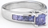 Natural princess cut  purple sapphire ring in 14k white gold with channel set princess cut sapphires